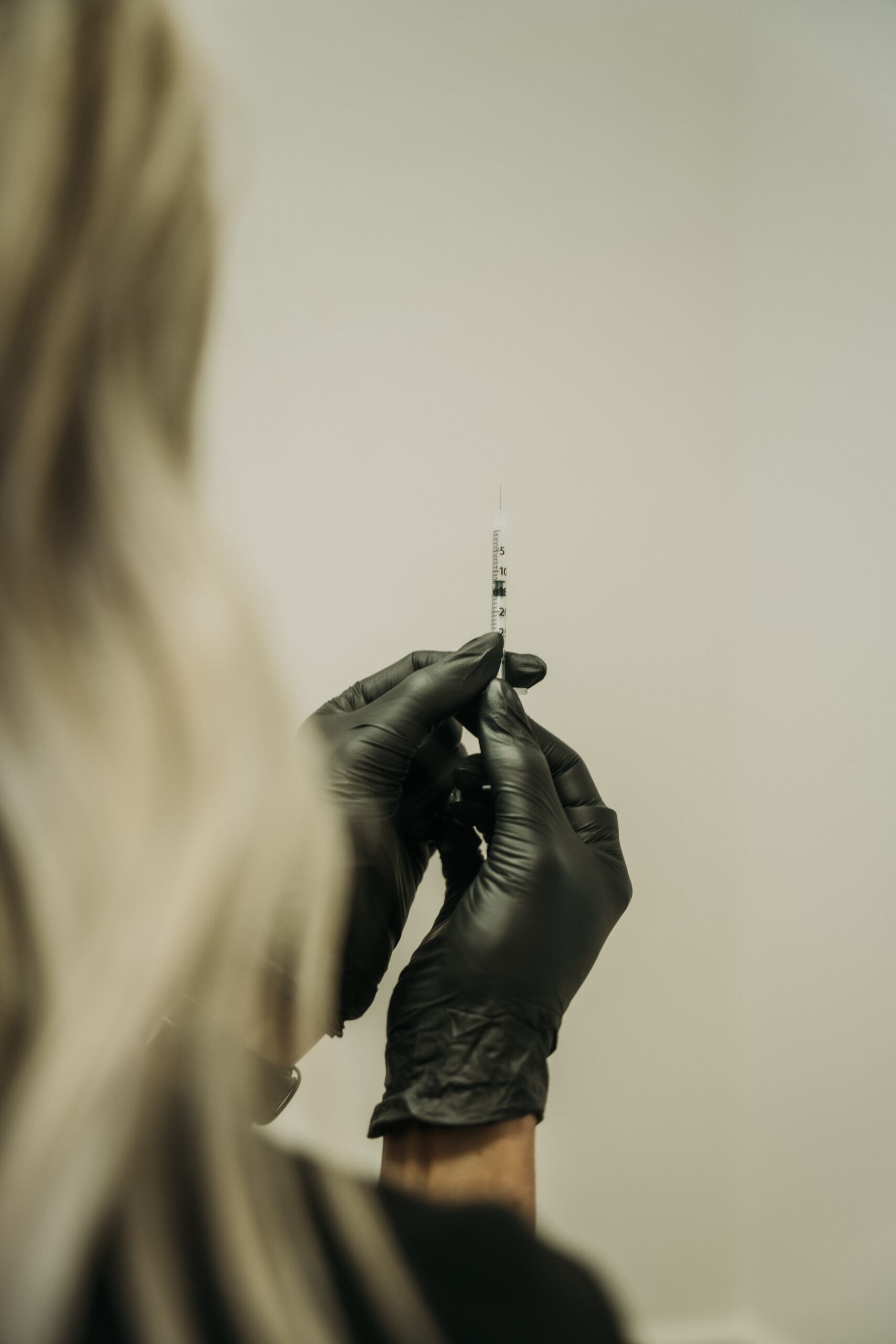 Revival medical provider performing a precise cosmetic injectable treatment