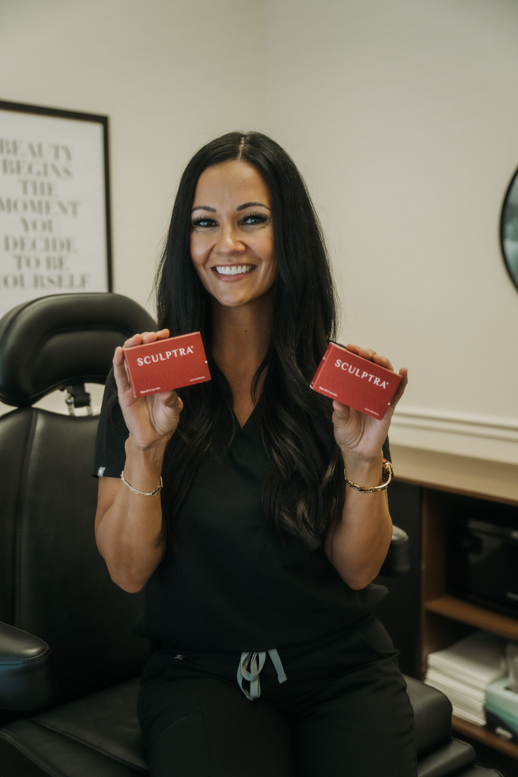 Shea Nielsen holding Sculptra products at Revival
