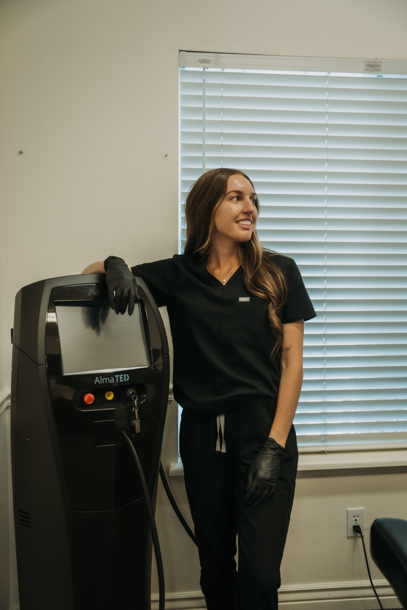 Revival provider working with the Alma TED hair and scalp treatment system